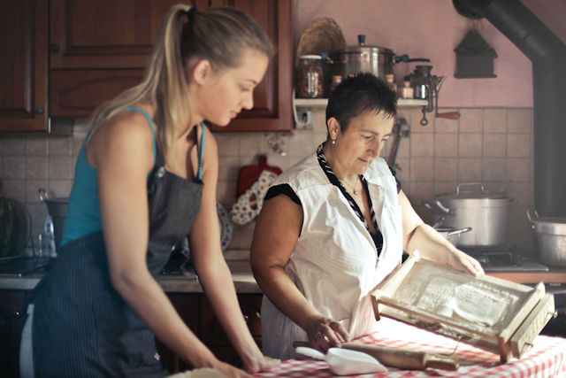 two women baking in kitchen