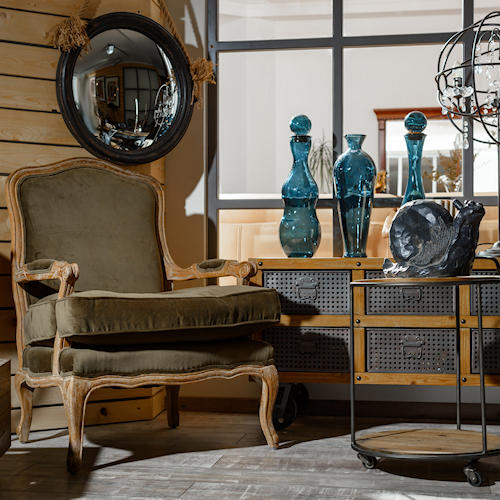 wooden chair, round mirror, turquoise vases, wooden desk